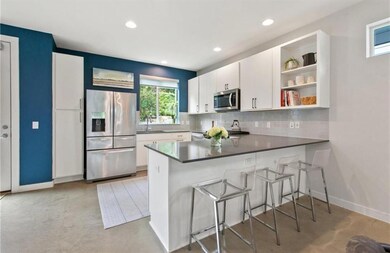 Kitchen with stainless steel appliances, tasteful