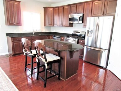 Large Eat-in Kitchen boasts Gleaming Hardwood Floo
