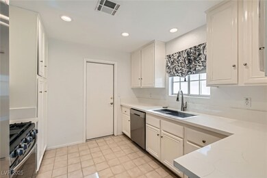 Kitchen featuring dishwasher, range with gas cookt