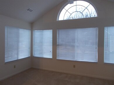 Bright sunroom with sliding double pane windows al