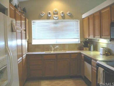 Spacious kitchen with tile counter tops