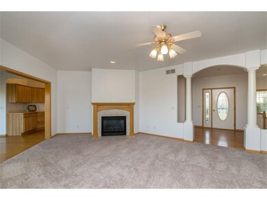 Main floor living room with gas fireplace, fresh p