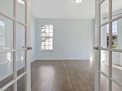 Main level office boasts French doors for work space privacy