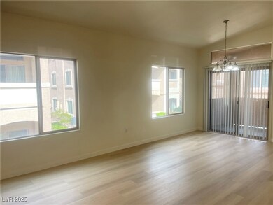 Spare room with baseboards, an inviting chandelier