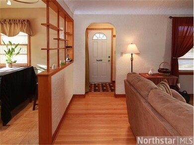 Hardwood floors lead you from the foyer into the m