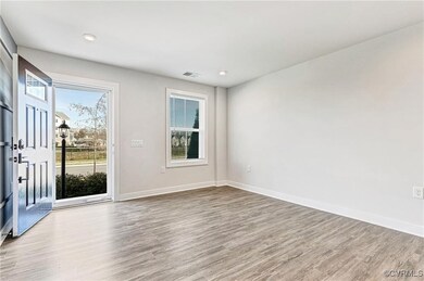 Empty room with wood finished floors, baseboards,