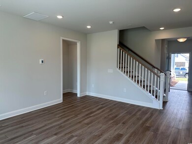 Spare room with dark hardwood / wood-style floors