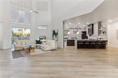 Living area with light wood-style floors, ceiling
