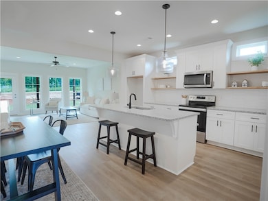 Kitchen & Dining Area with exposed shelving
