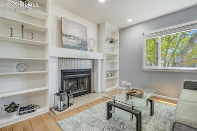 Living room featuring light wood-type flooring, a 
