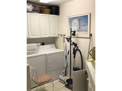 SEPARATE LAUNDRY ROOM WITH FULL SIZE WASHER & DRYER, CABINETS AND LAUNDRY SINK