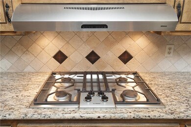 Separate high end gas cook top with vent hood. Sle