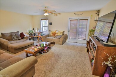 Spacious living room with plenty of sunlight.