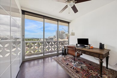 Office space featuring a wall of windows, concret