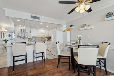 Dining space featuring visible vents, ornamental m