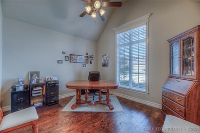 Hand-scraped floors in office with vaulted ceiling