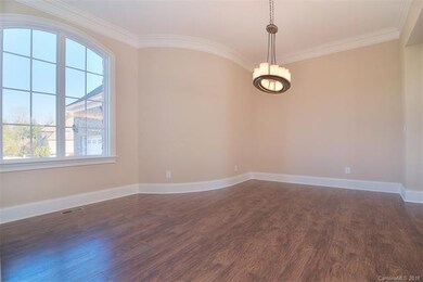 Beautiful Dining Room with custom lighting for ent