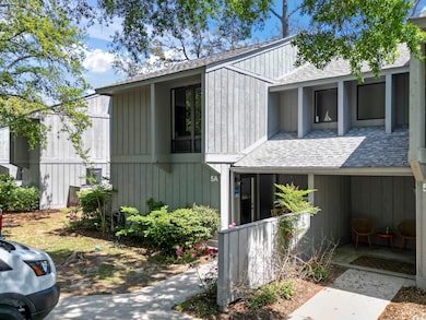 View of front of home with roof with shingles