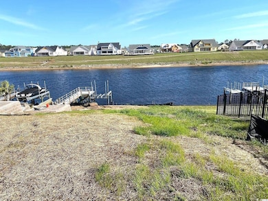 View of water feature featuring a boat dock