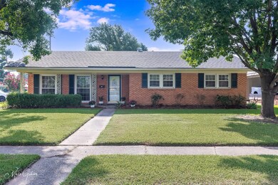 Single story home featuring a front yard