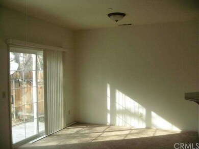 Family room adjacent to kitchen.  Slider door to p