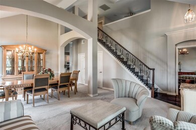 Soaring ceilings create a open, airy feeling in the formal living and dining areas