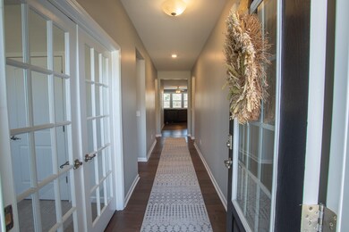 The light and bright neutral paint and beautiful hardwoods are featured in the main living areas of the home. 