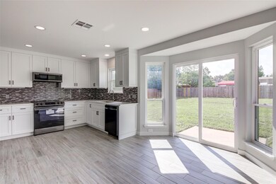 Kitchen featuring stainless steel appliances, dec