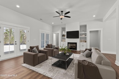 Living Room w/ Fireplace & Built-Ins