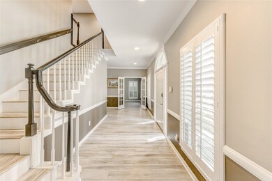 Plantation shutters grace the front of the home in