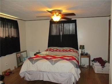Large Master Bedroom with ceiling fan.