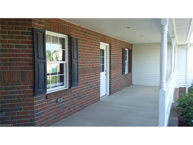 Large front porch with door conveniently entering 