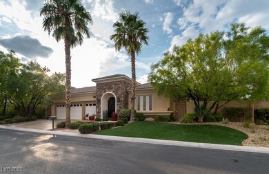 View of front of home with driveway, stone siding,