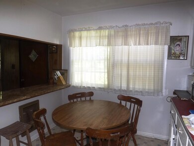 The country kitchen has space for a breakfast table.