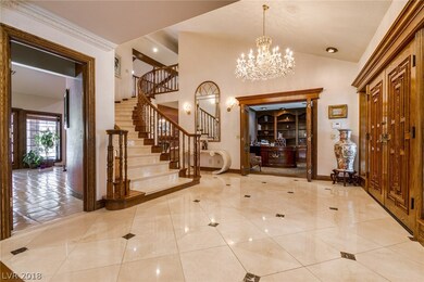Entrance has marble floors and 17' vaulted ceiling