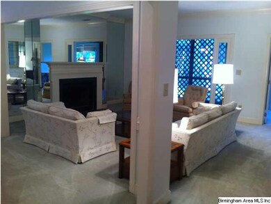 LIVING ROOM WITH FIREPLACE AND OPEN TO THE SUNPORC