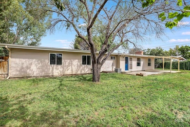 Rear view of property with a patio area and a chimney