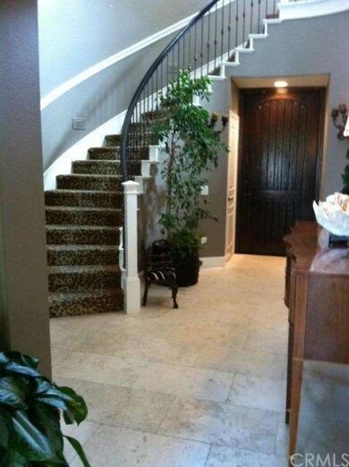 Elegant circular staircase with wrought iron raili