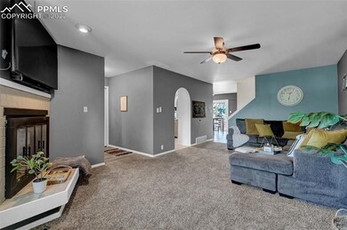Living room with the kitchen and dining room in th