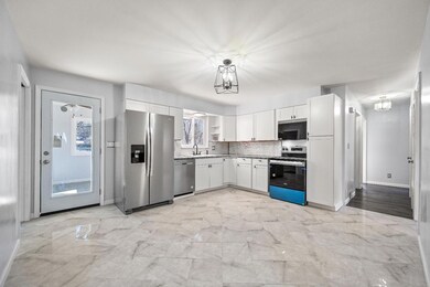 Marble, granite & brushed stainless make this kitc