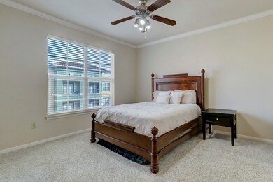 This bedroom features a cozy atmosphere with a plu
