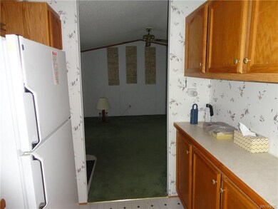 As you look into the living room from the kitchen