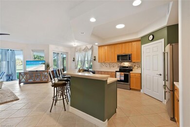 Kitchen with a tray ceiling, stainless steel appli