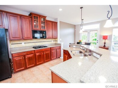 Tile floors and backsplash, cherry cabinets, grani