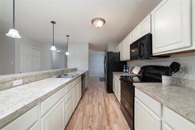 White cabinets with lots of storage, plus a big pa