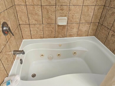 Bathroom with a washtub