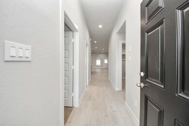 As you step into the threshold of this luxurious home, you'll soon be welcomed by an elegant glass door (to be installed). Inside, soaring ceilings amplify the spaciousness, while the refined wood-look tile flooring and oversized baseboards exude sophistication and charm. Sample photo of completed home with similar floor plan. Actual colors and selections may vary.
