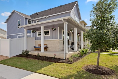 View of front of property with covered porch, roo