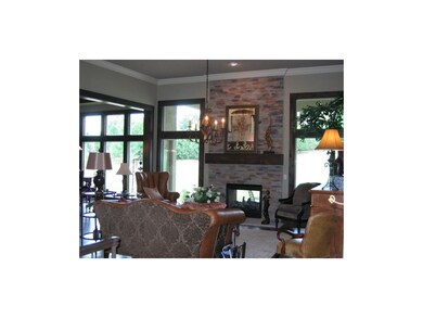 Great room with floor to ceiling see through firep