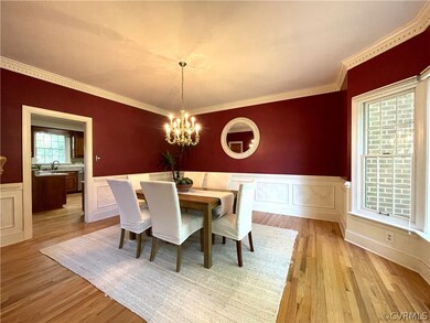 Dining space with ornamental molding, sink, light